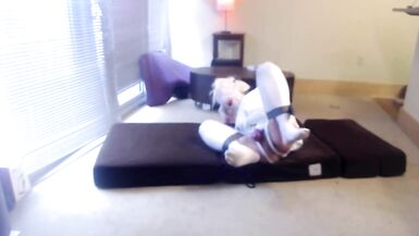 Caged & Plugged Sissy in Selfbondage Straitjacket and a Harley Quinn Wig - 8 image