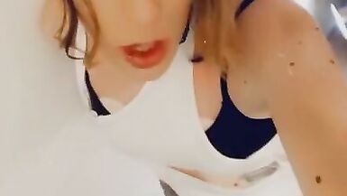 Cute Trans in White Strokes her Clitty - 2 image